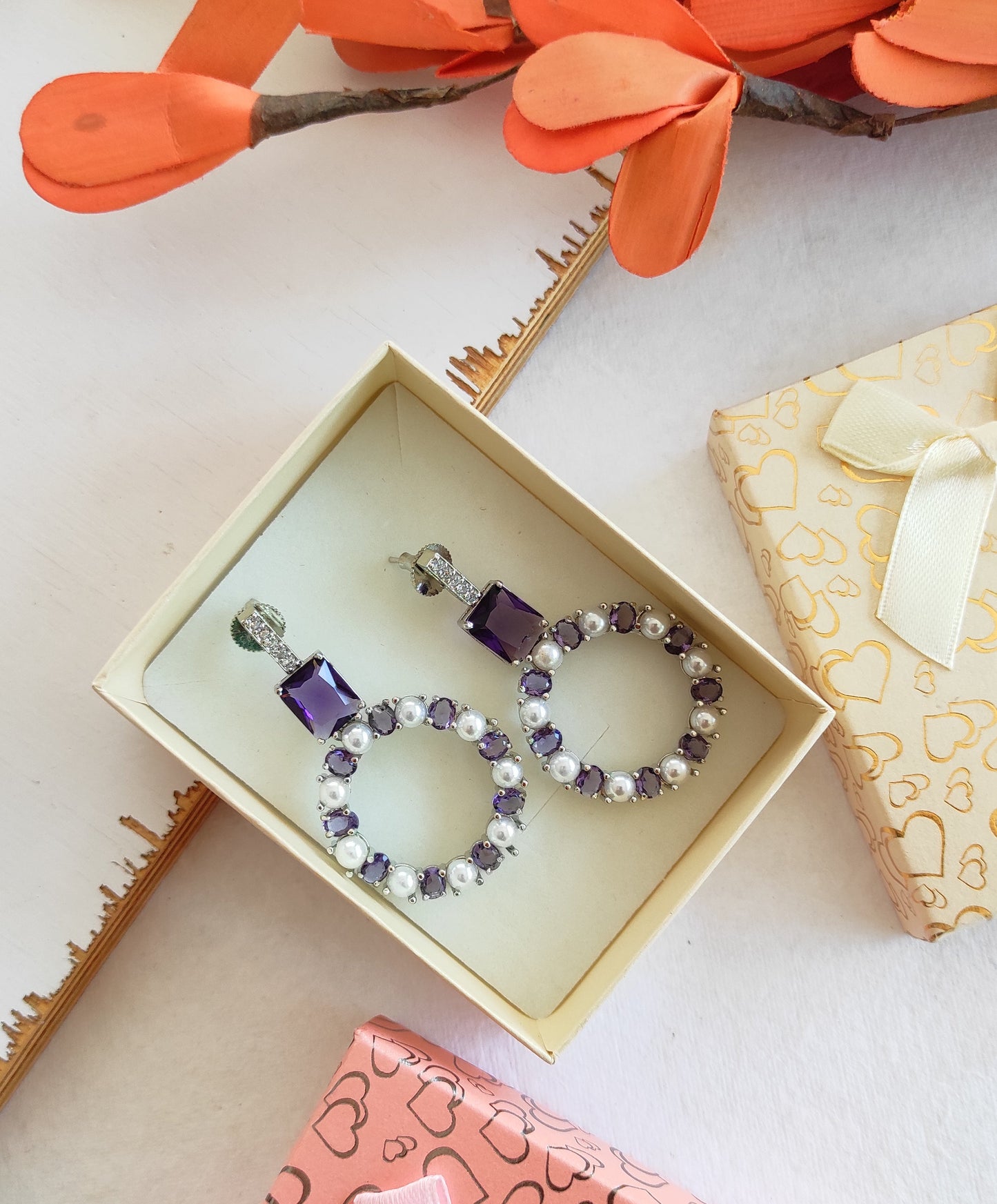 Purple zirconia and pearl studded earrings