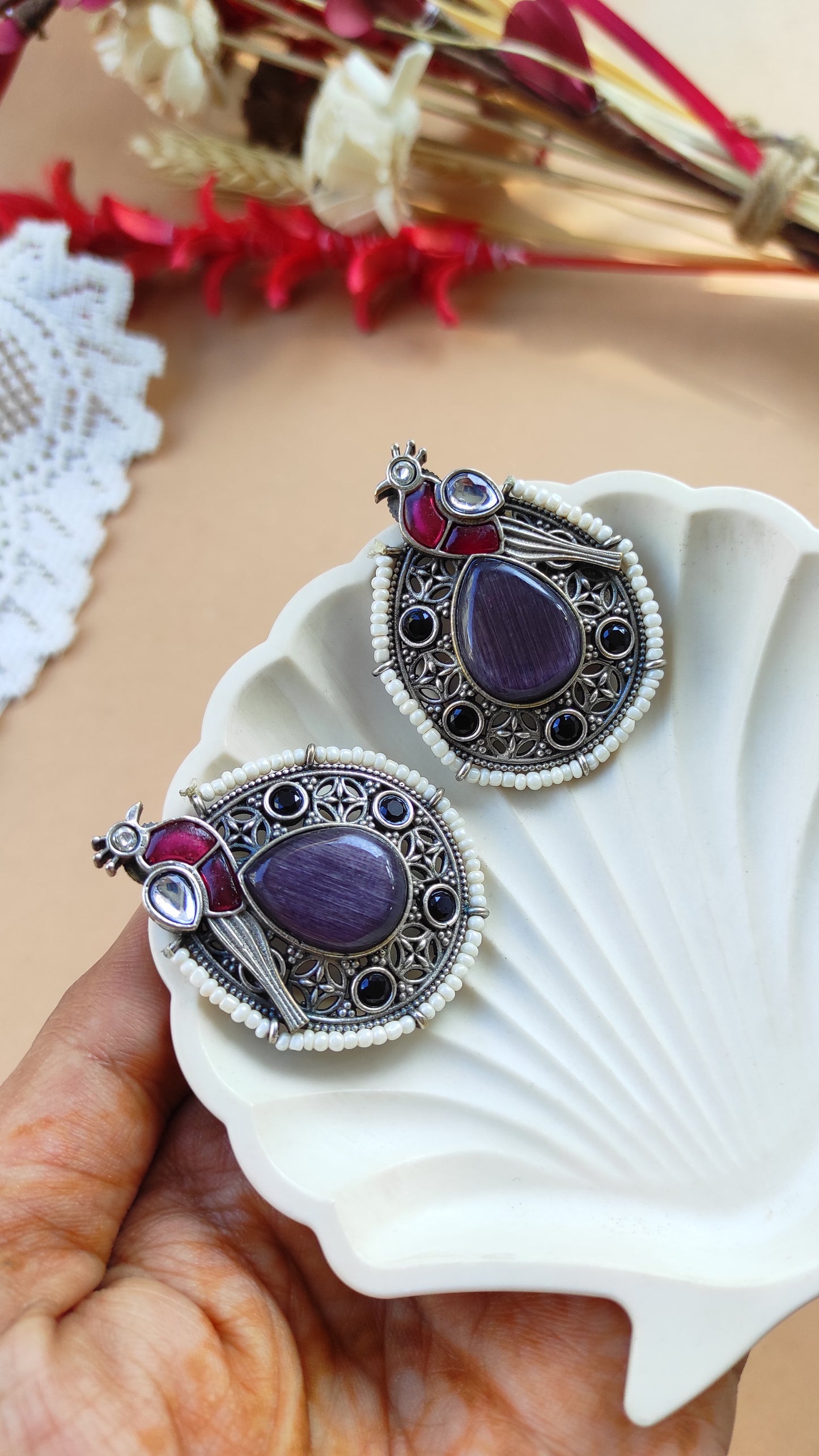 Peacock intricate work studs earrings in silver lookalike brass