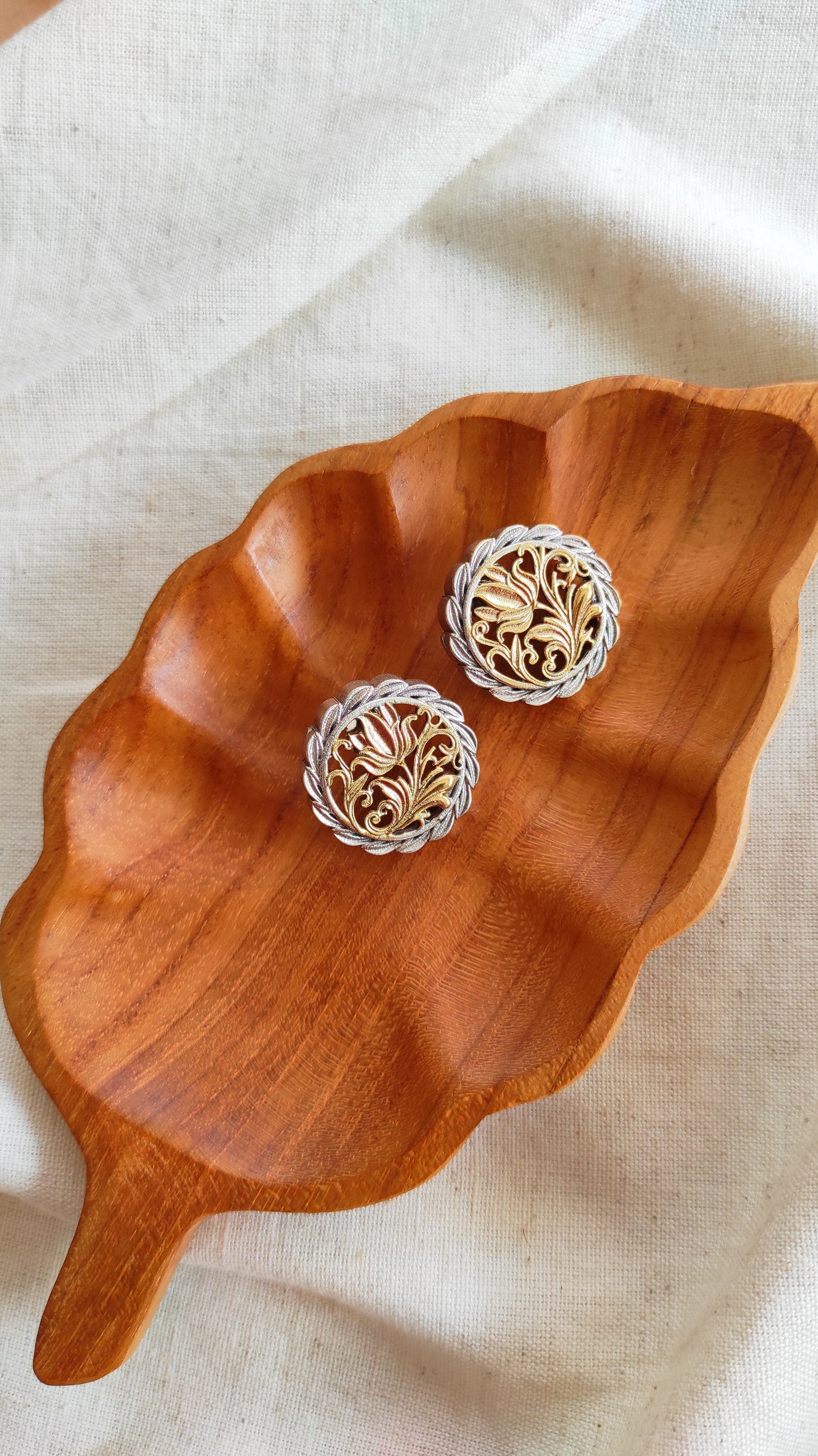 Nanda dual tone studs earrings