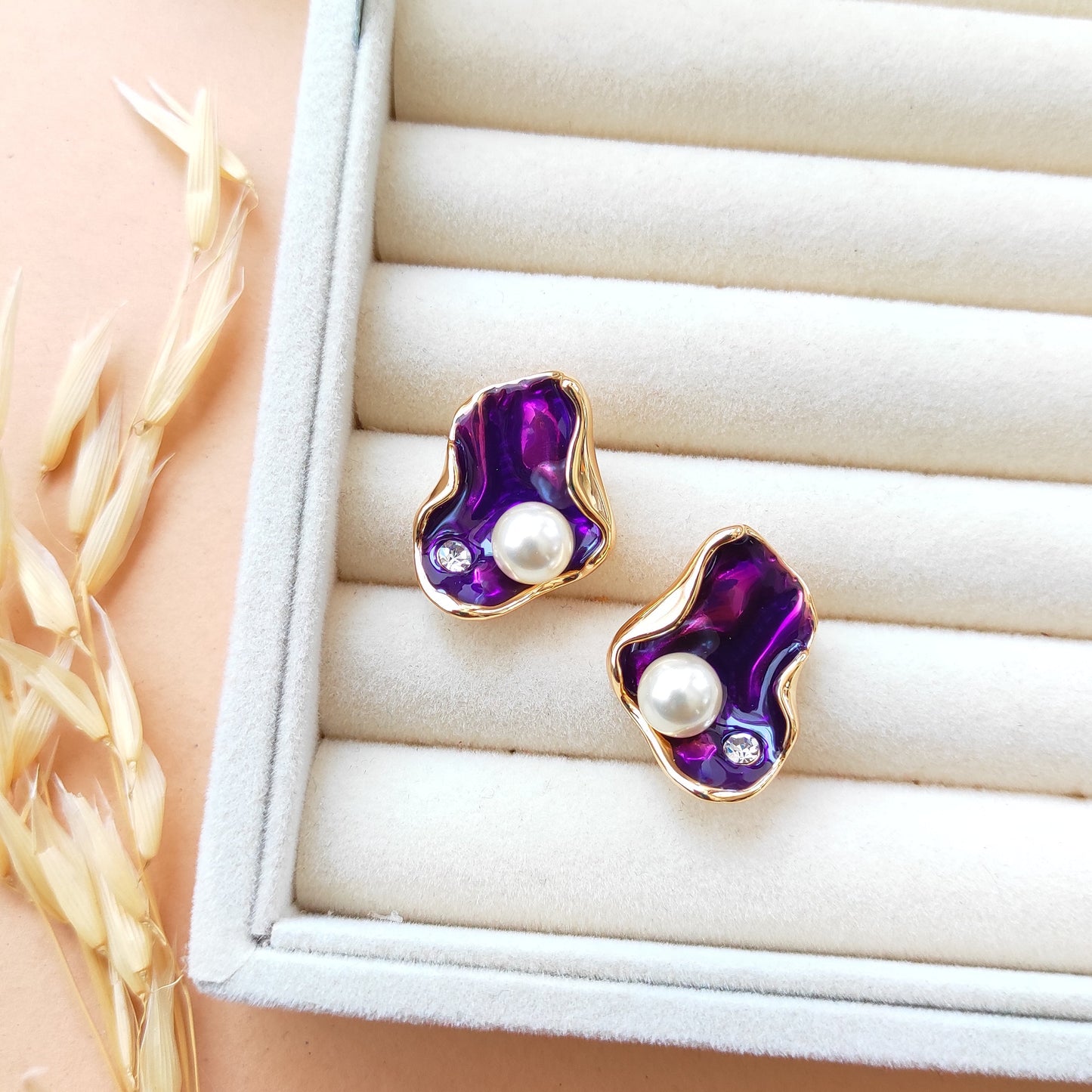 Golden enameled shell studs earrings