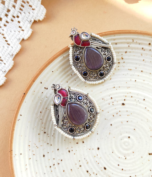 Peacock intricate work studs earrings in silver lookalike brass