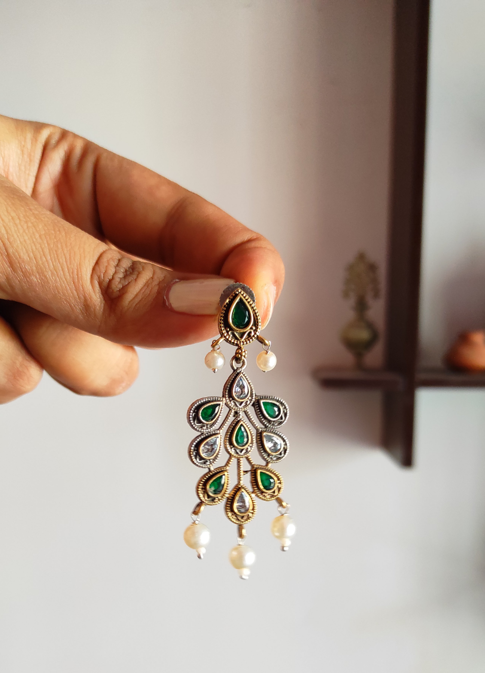 Nirja dual tone dangling earrings