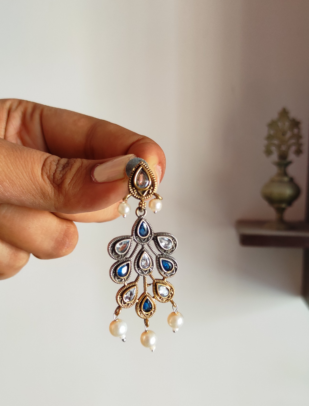 Nirja dual tone dangling earrings