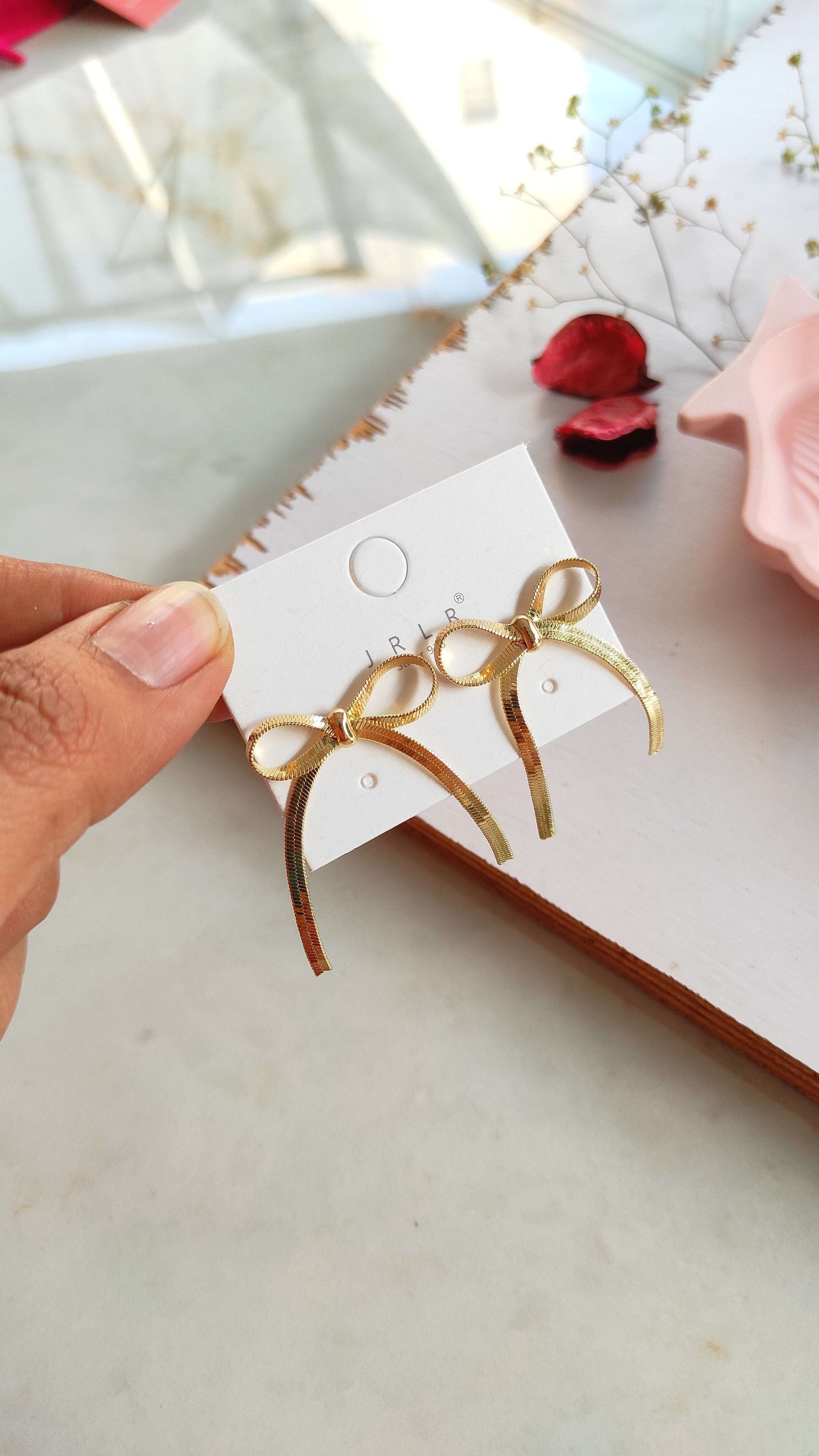Golden bow earrings
