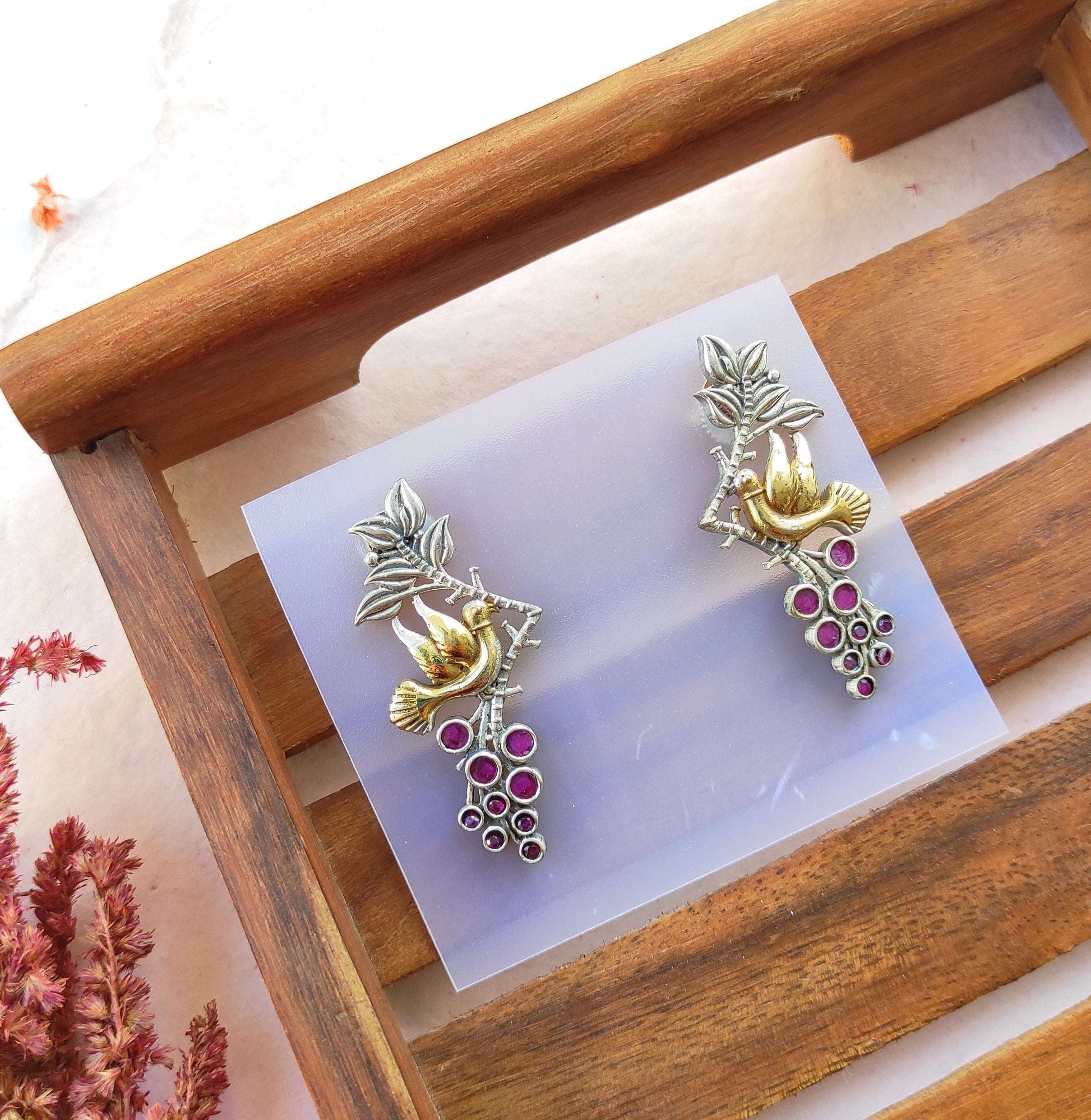 Parinda dualtone studs earrings