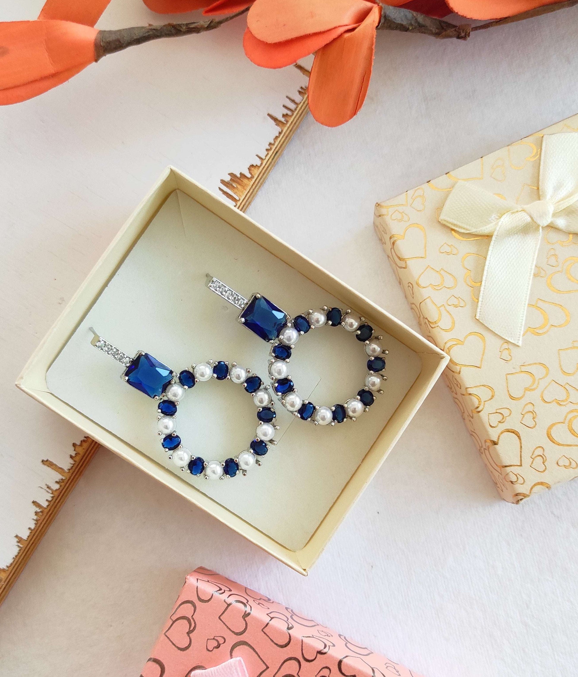 Blue zirconia and pearl studded earrings