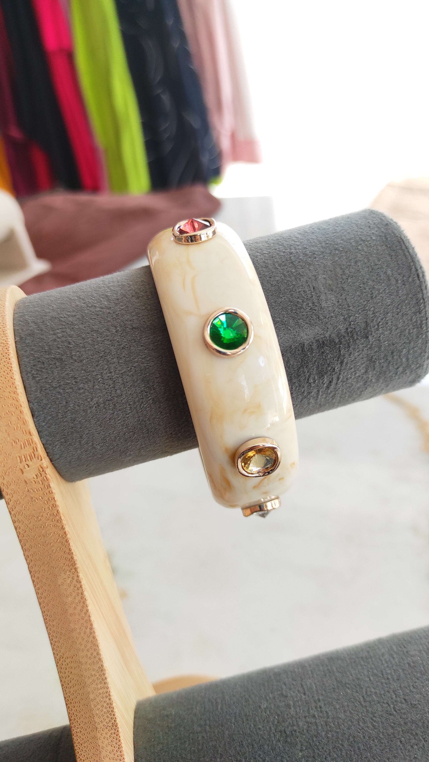 Resin bangle with multi color stone embellishments