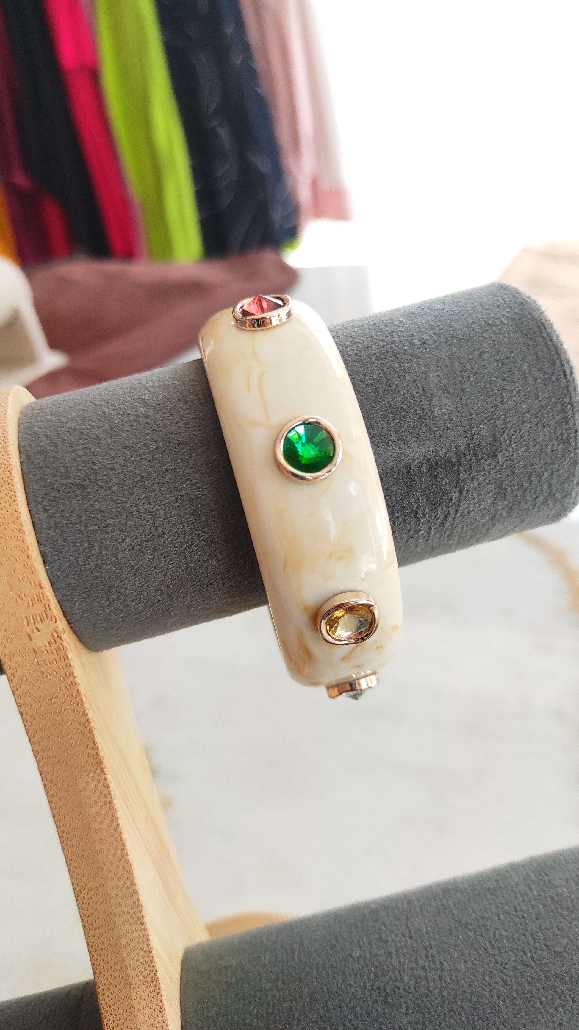 Resin bangle with multi color stone embellishments