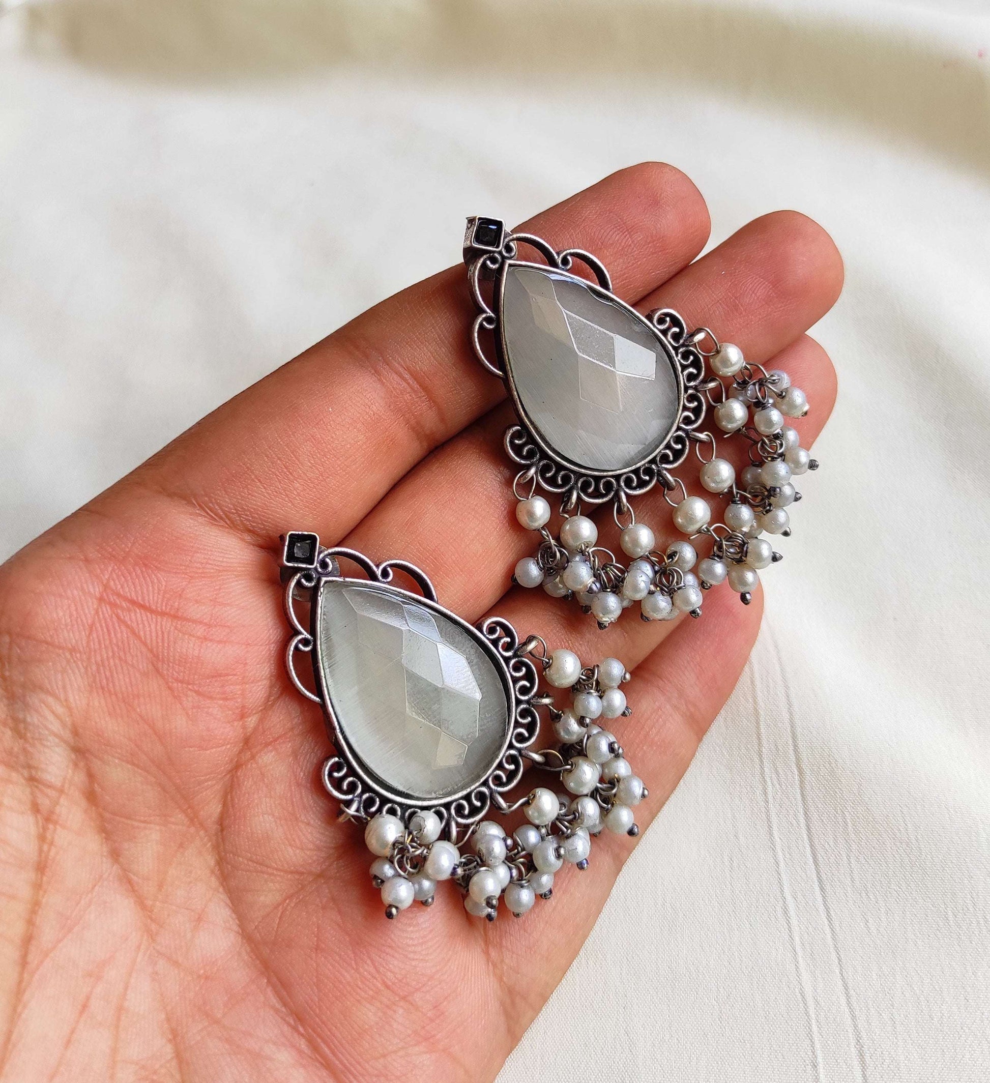Tear drop studs with color stones and pearl hangings