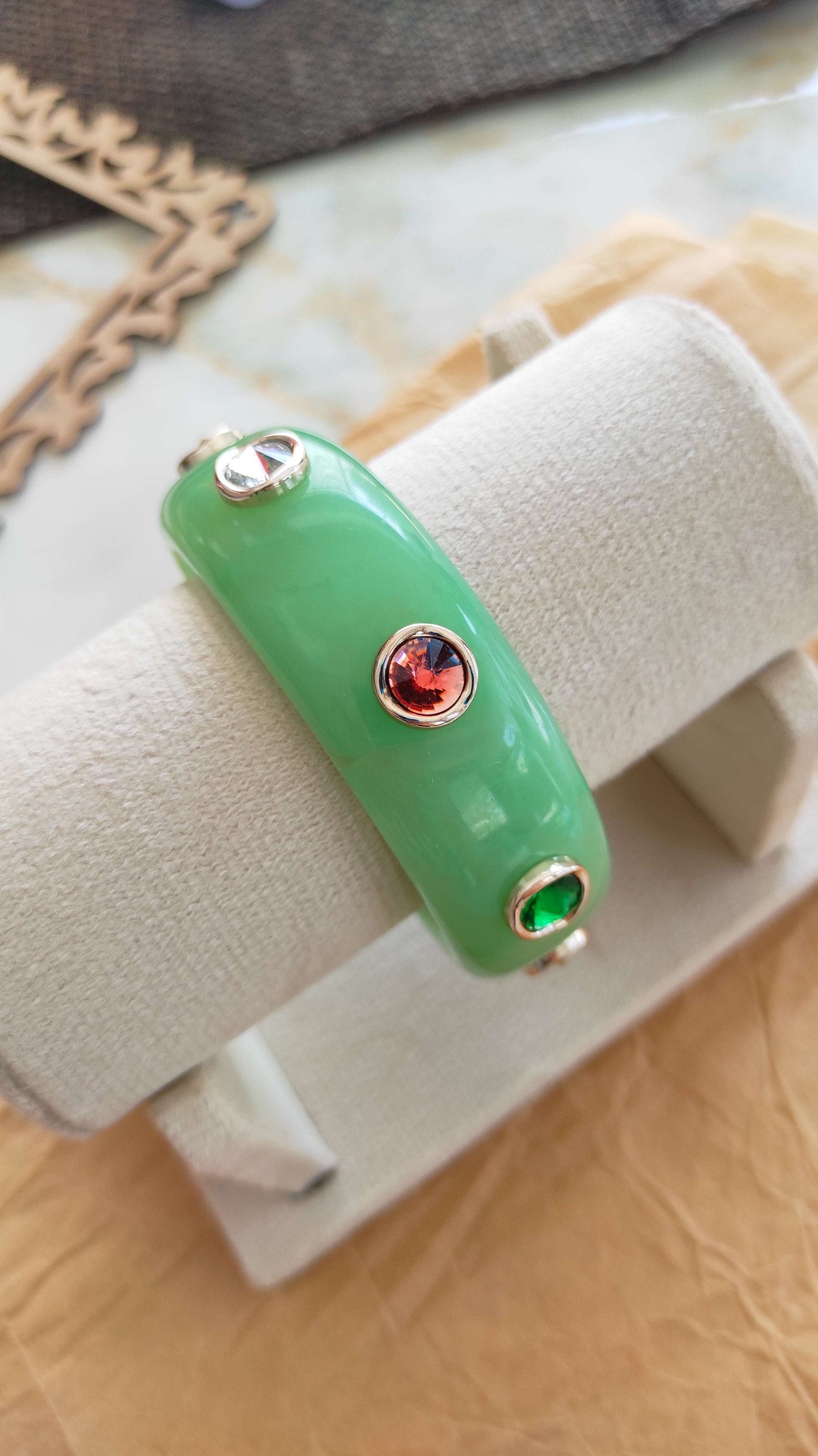 Resin bangle with multi color stone embellishments