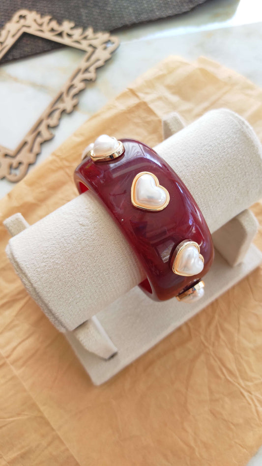 Maroon resin bangle with pearl heart embellishments