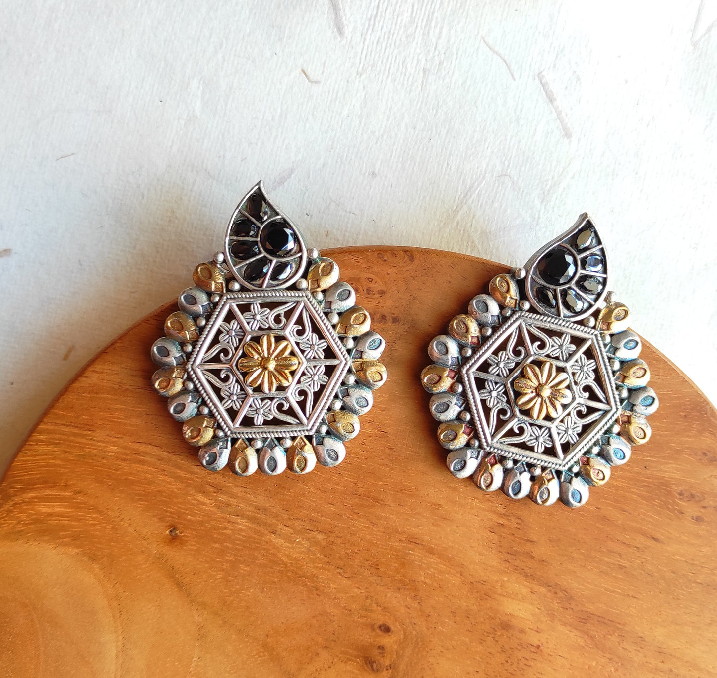 Hexagonal dualtone studs earrings with premium glass stones