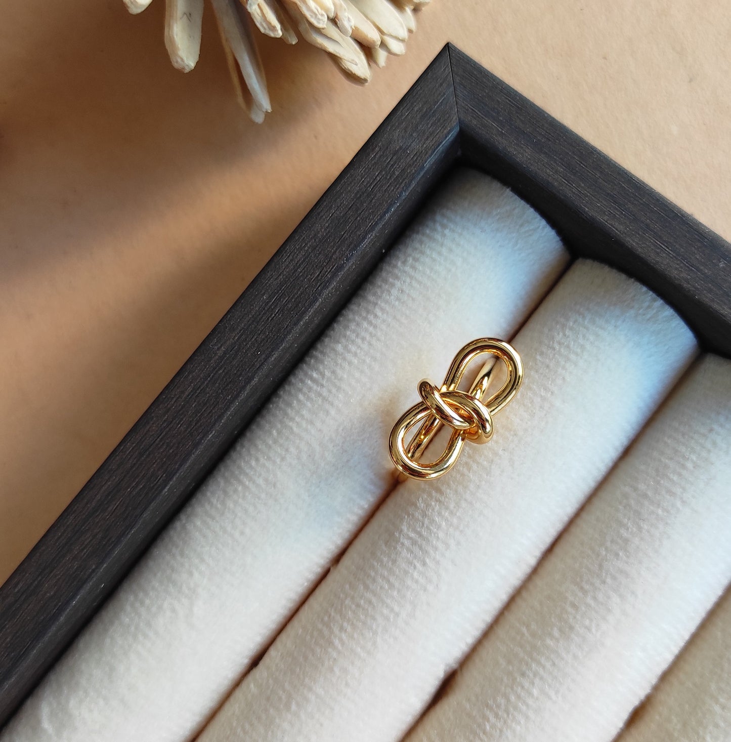 Knotted bow gold plated adjustable finger ring