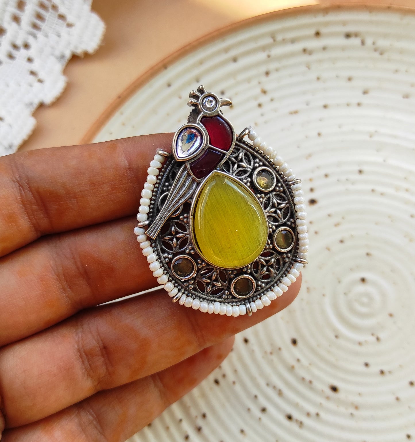 Peacock intricate work studs earrings in silver lookalike brass