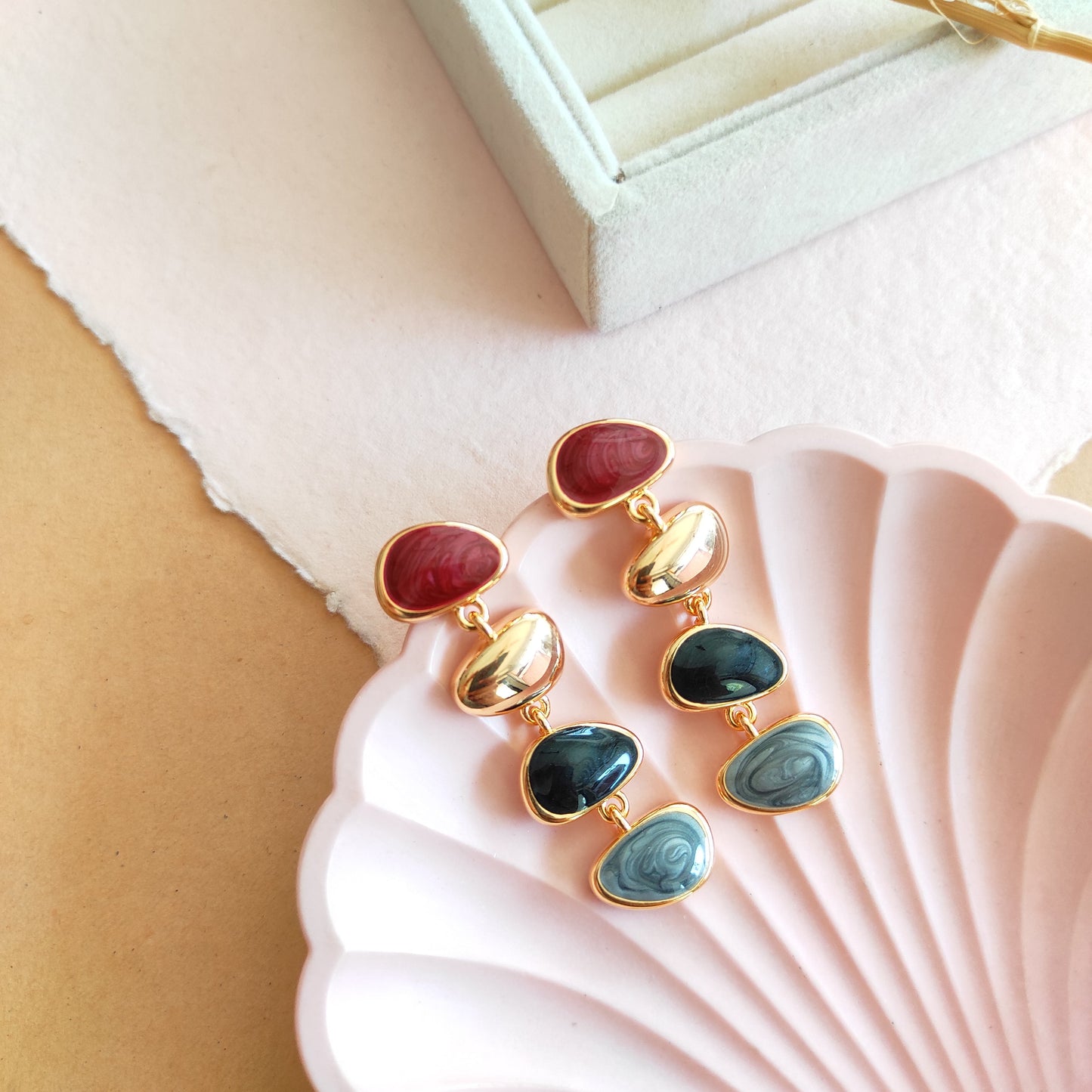 Golden enameled bubble dangling earrings
