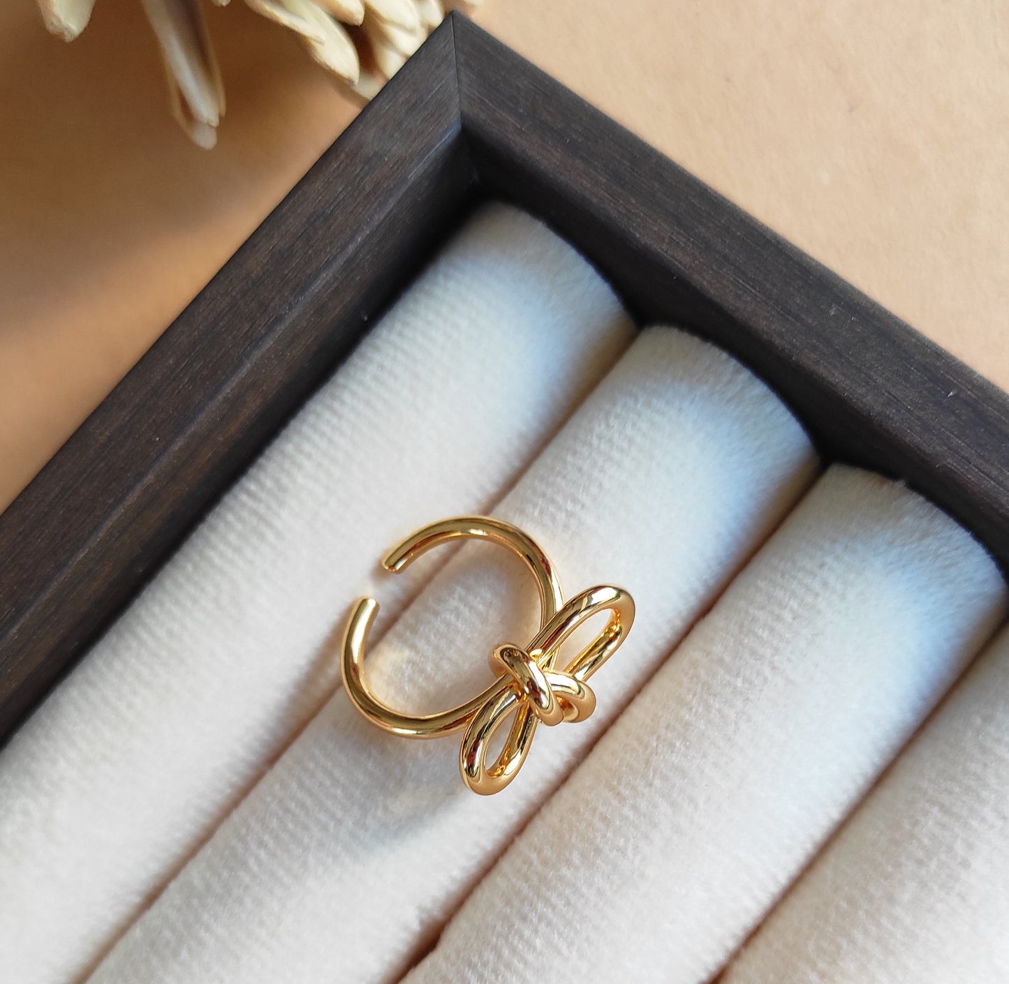 Knotted bow gold plated adjustable finger ring