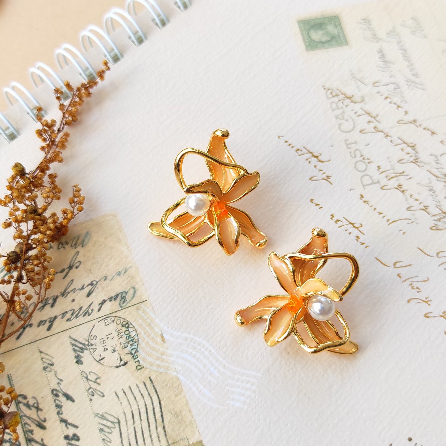 Golden enameled flora studs earrings