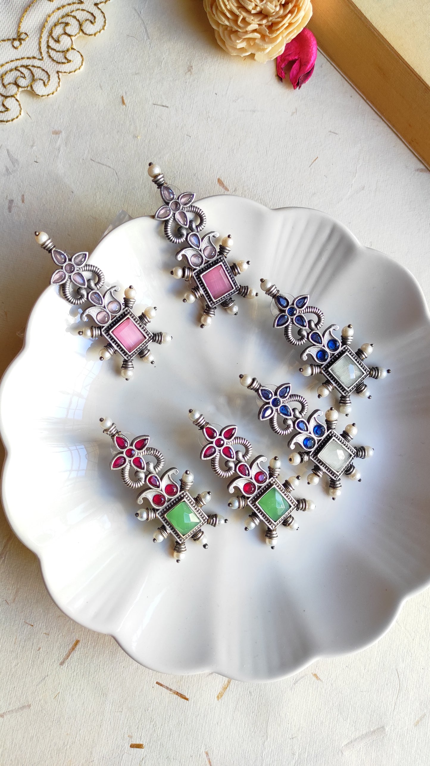 Sapna silver lookalike studs earrings