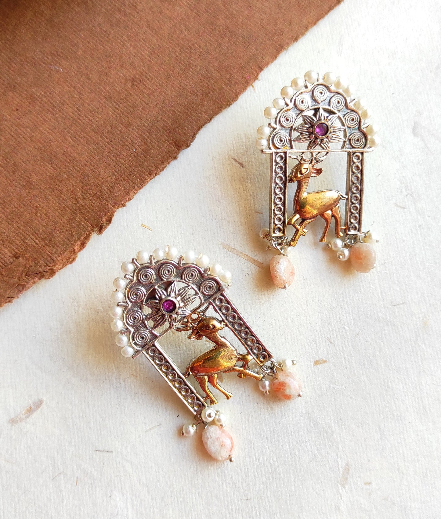 Hirni dualtone studs earrings