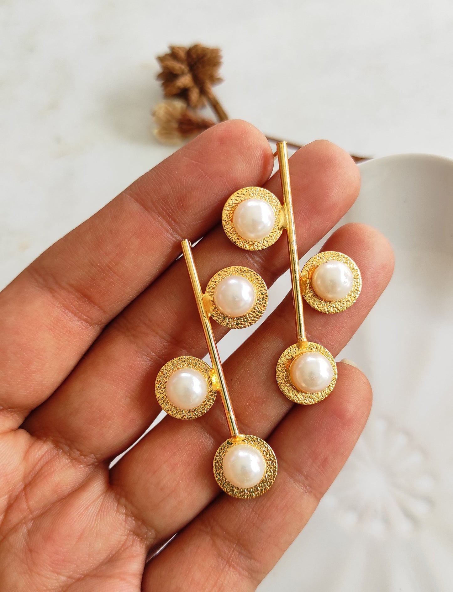 Tri-pearl golden earrings