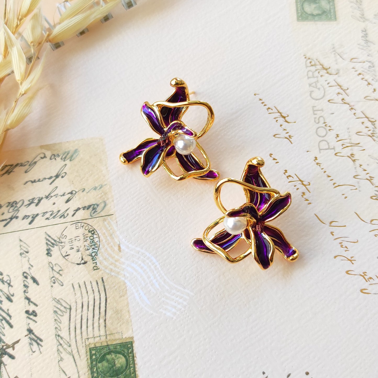 Golden enameled flora studs earrings