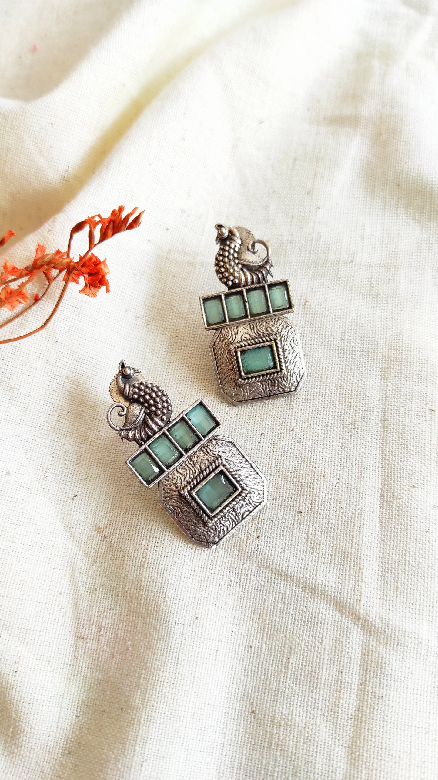 Square peacock silver lookalike studs earrings