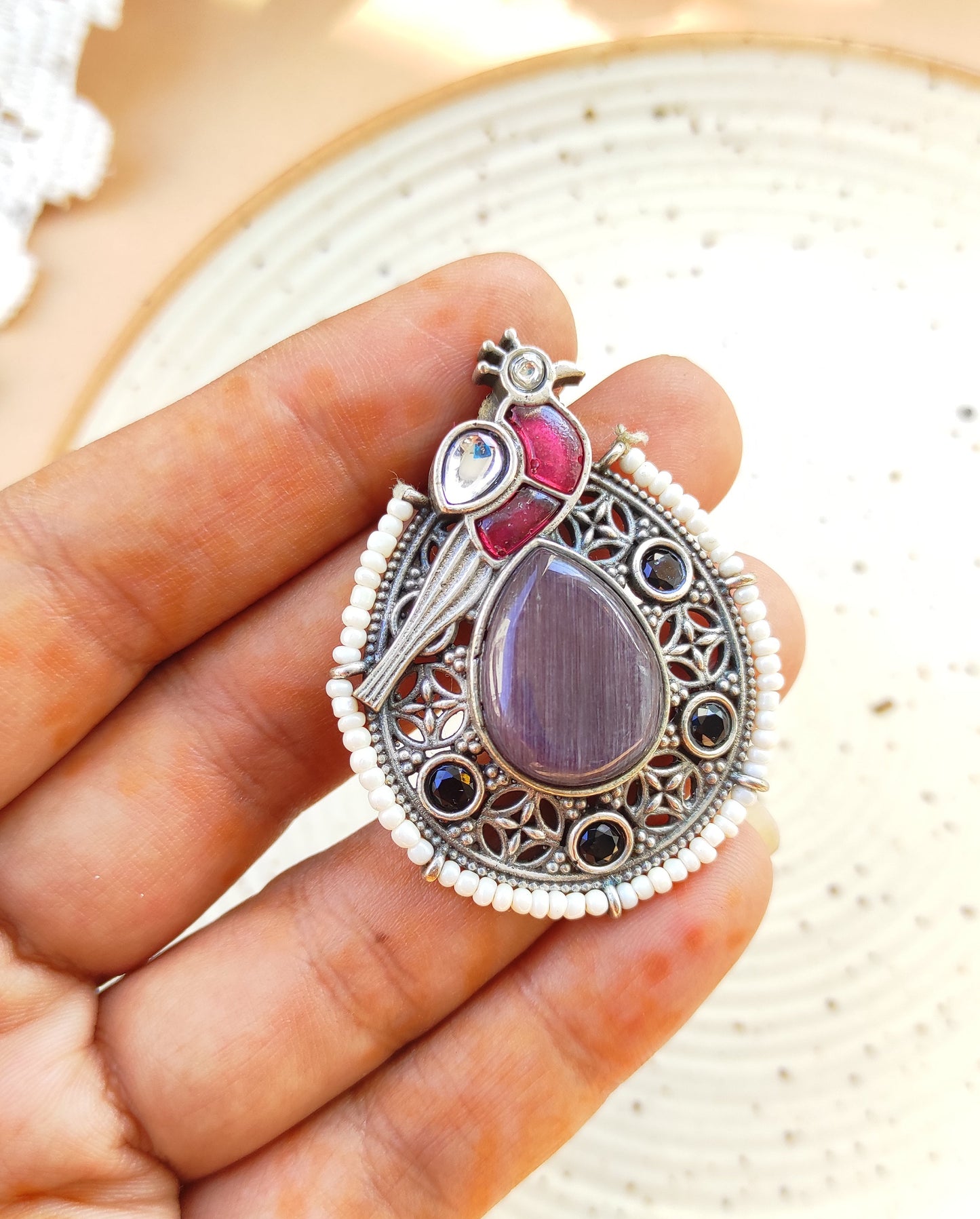 Peacock intricate work studs earrings in silver lookalike brass