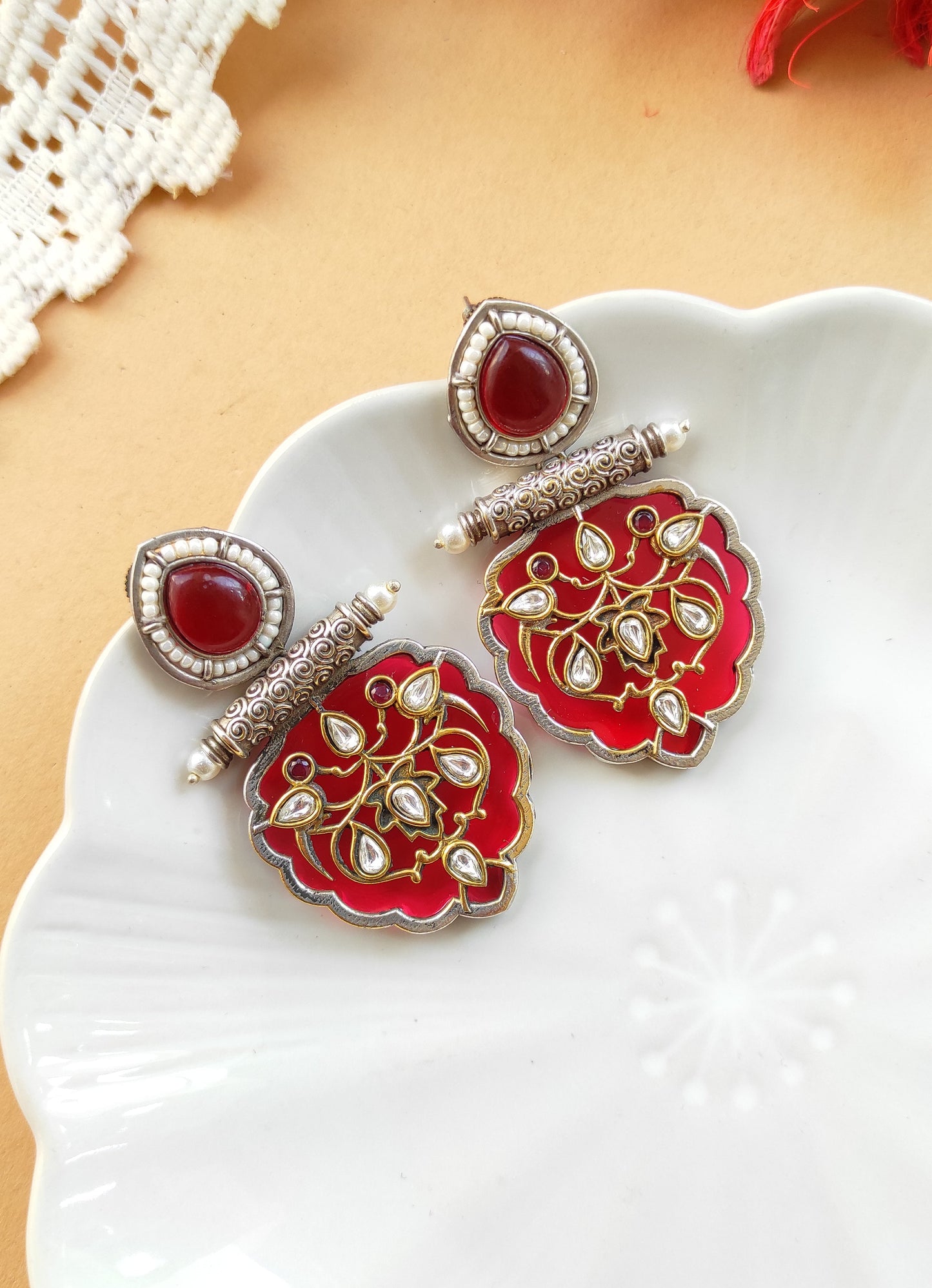 Jhilmil dual tone earrings with intricate carving and kundan