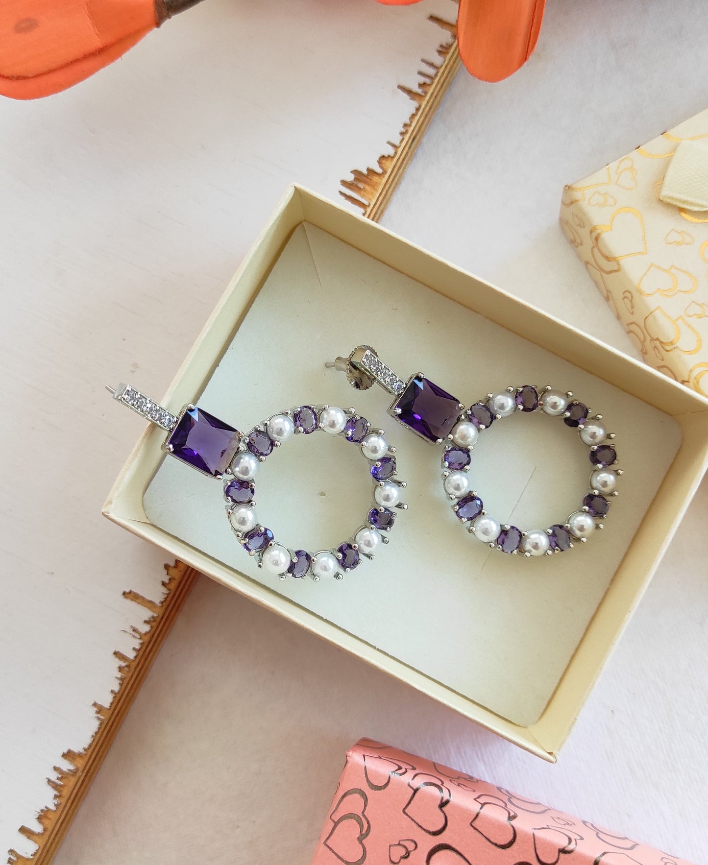 Purple zirconia and pearl studded earrings