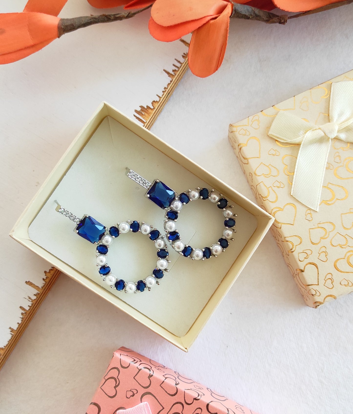 Blue zirconia and pearl studded earrings