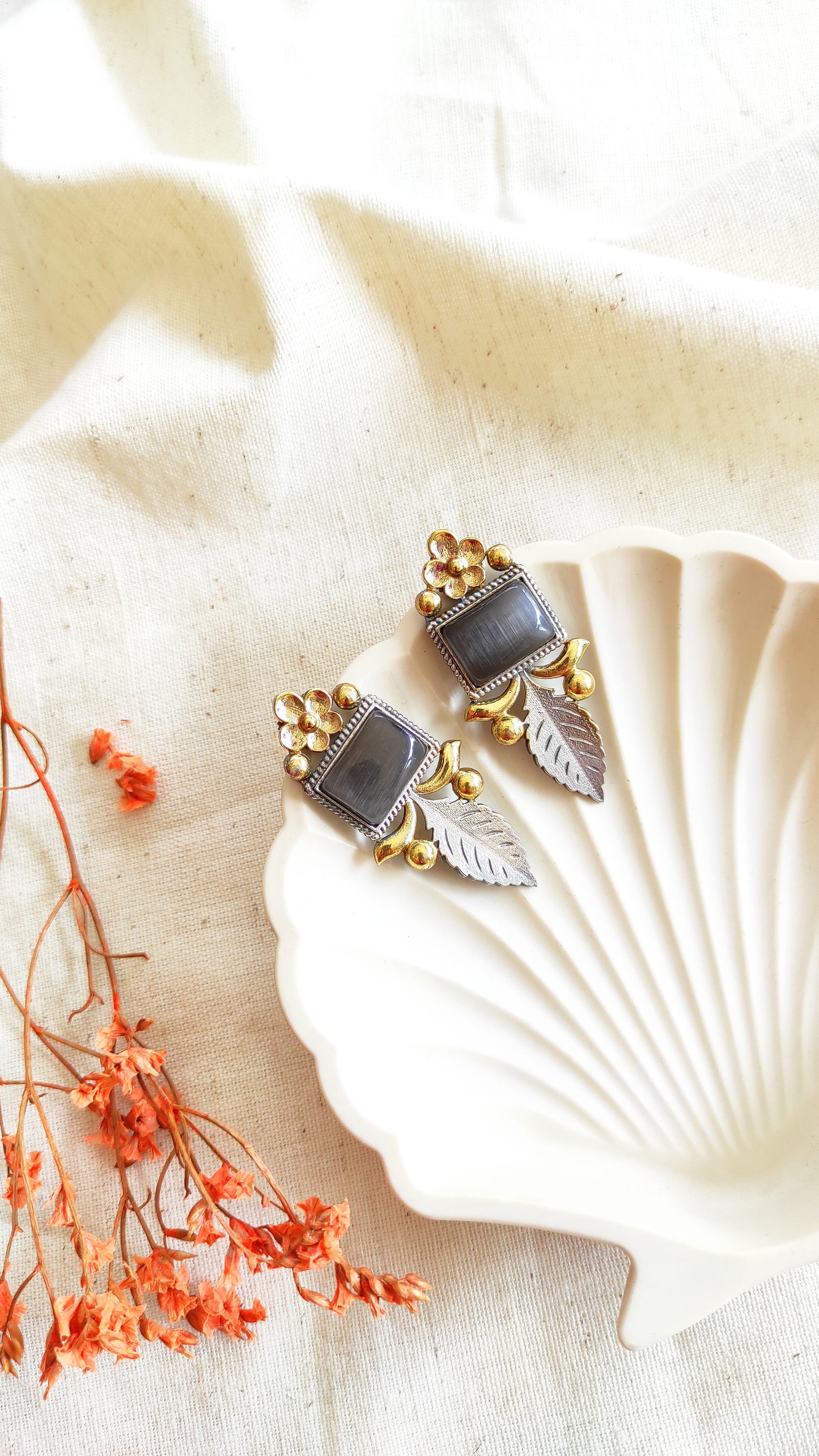 Jiya dual tone studs earrings