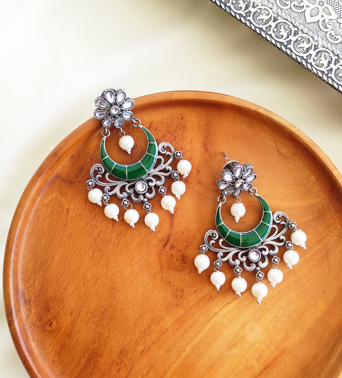 Sajani enameled chandbali earrings