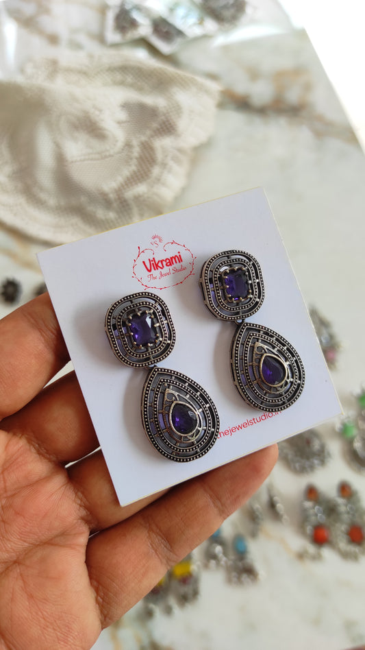 Purple pluto earrings