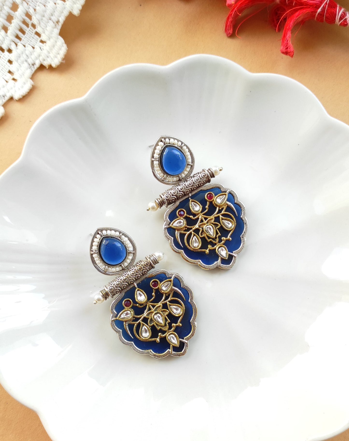 Jhilmil dual tone earrings with intricate carving and kundan