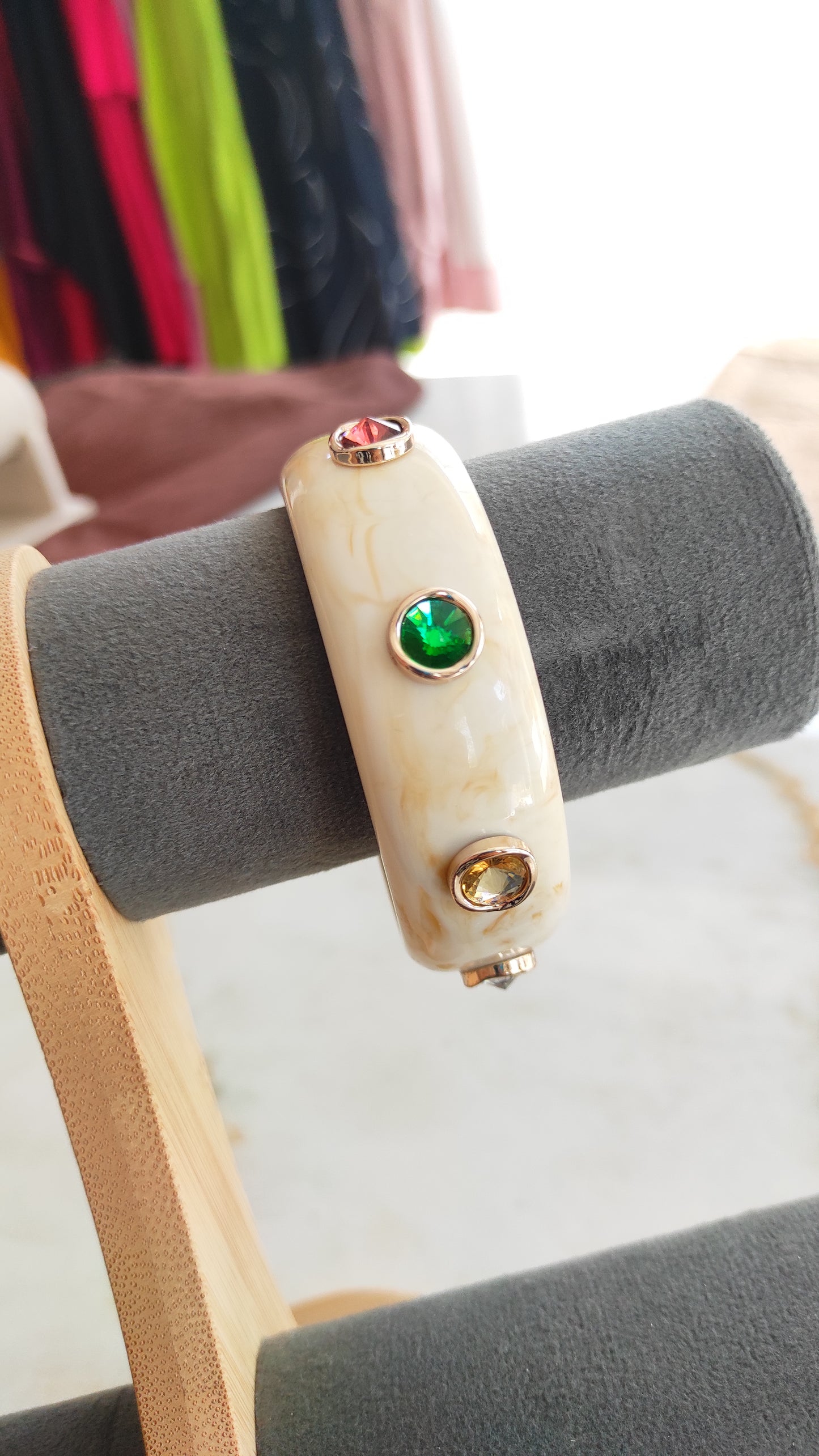 Resin bangle with multi color stone embellishments