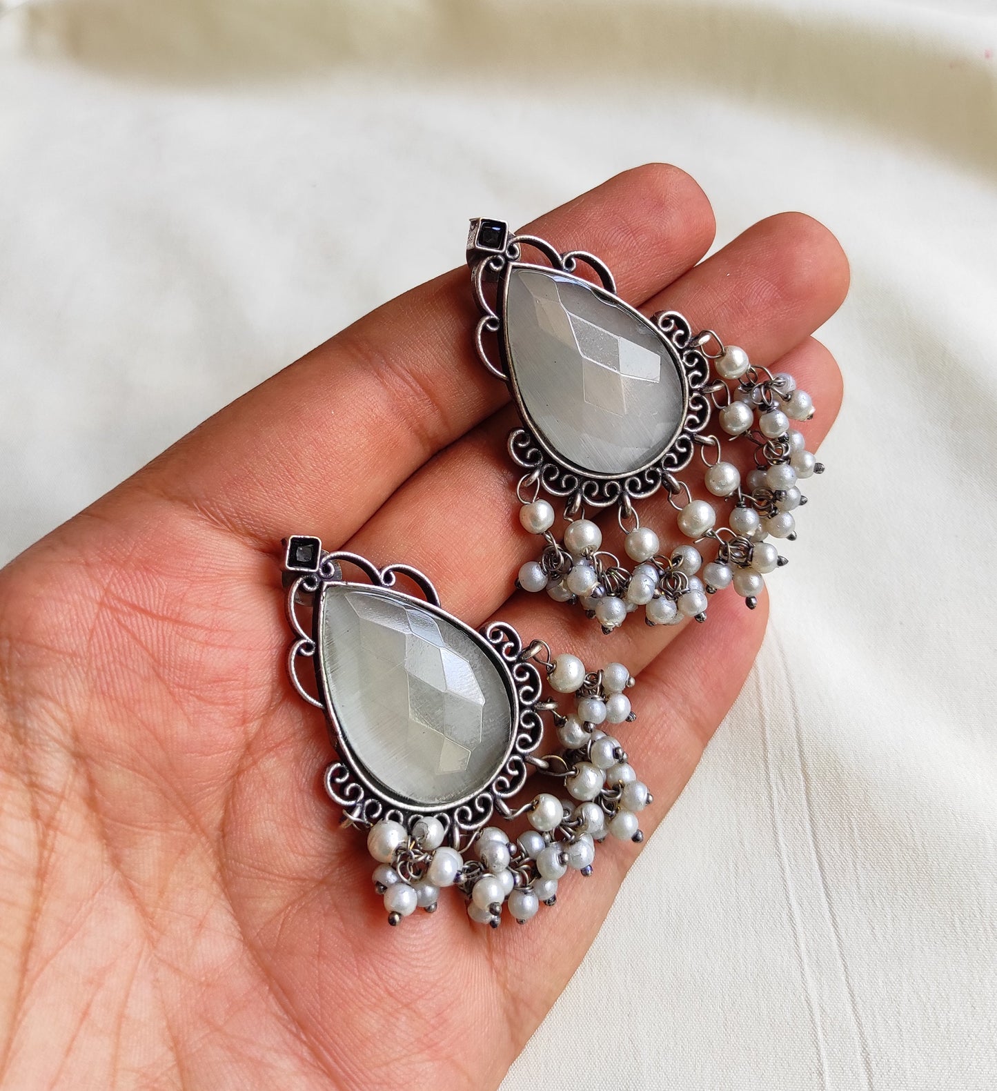 Tear drop studs with color stones and pearl hangings