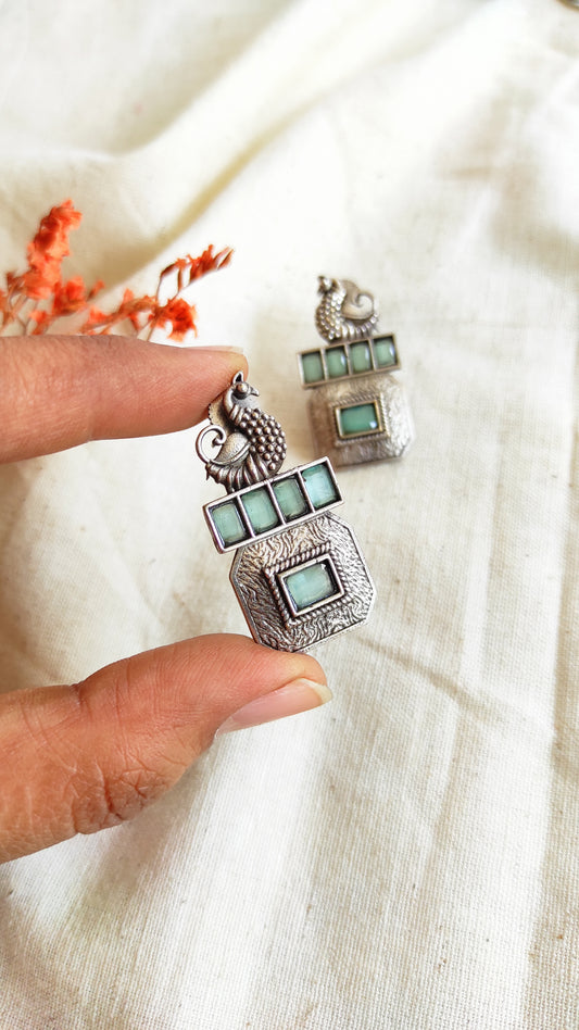 Square peacock silver lookalike studs earrings