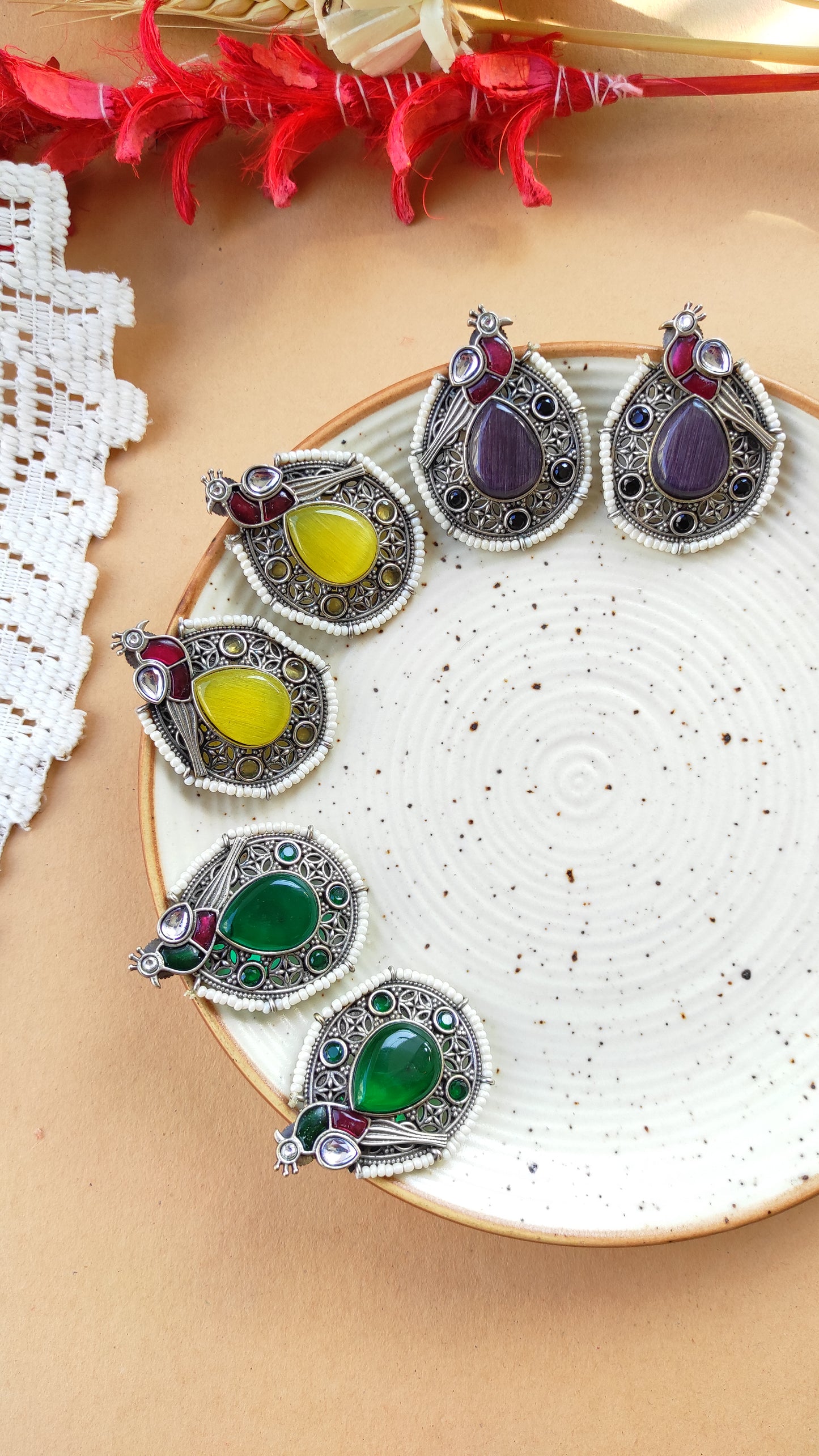 Peacock intricate work studs earrings in silver lookalike brass