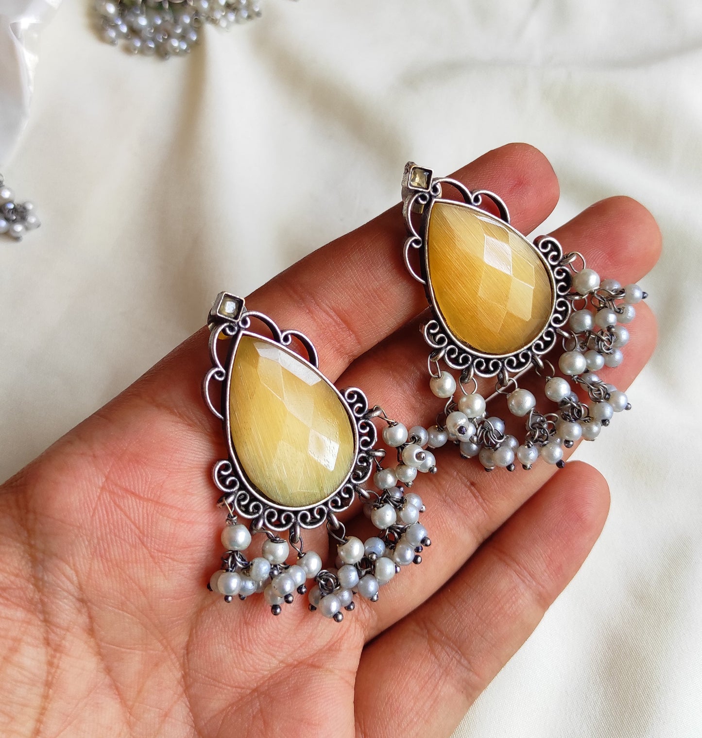 Tear drop studs with color stones and pearl hangings