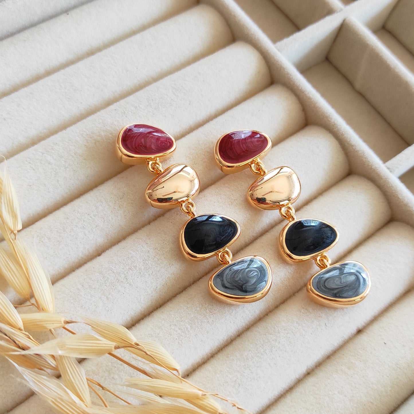 Golden enameled bubble dangling earrings